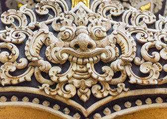 White Rahu statue on wall Thai temple