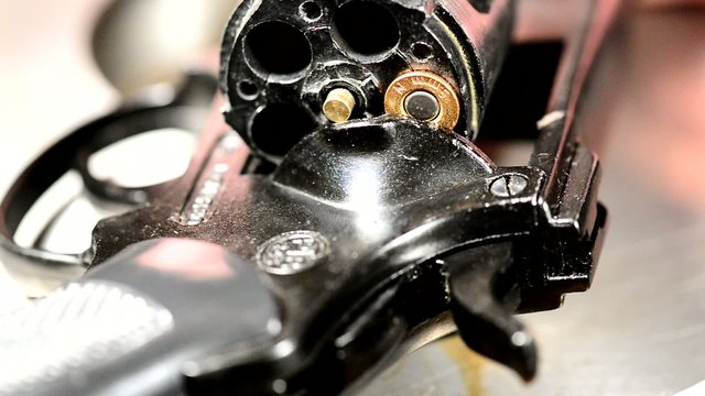 detail of revolver with one cartridge ,real time,