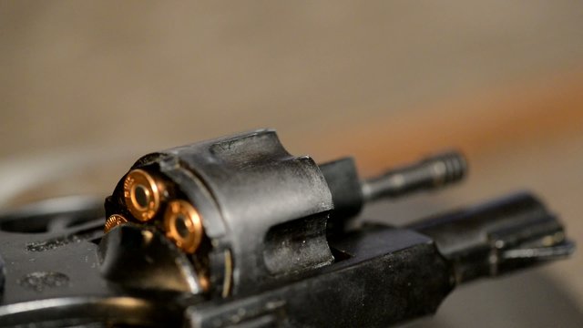 detail of revolver with cartridges ,real time,panning,rotation