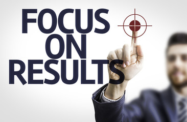 Business man pointing the text: Focus on Results
