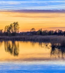 Fototapeta premium sunset in Zinnowitz with reflection on the water