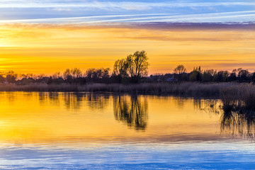 sunset in Zinnowitz with reflection on the water