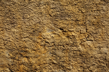 Stone wall yellow in small cracks
