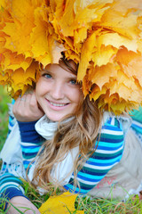 Woman holding autumn leaf