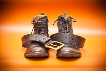 men's leather shoes and a leather belt with a buckle
