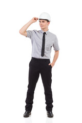 Relaxed engineer looking away. Full length