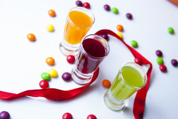 Obraz na płótnie Canvas vodka with colorful candy