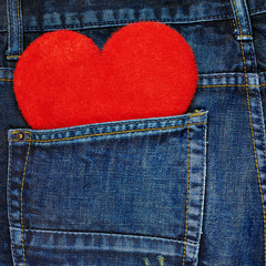 Red heart in a back pocket of a jeans