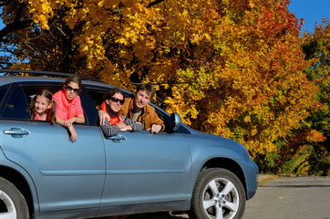 Car trip on autumn family vacation, parents and kids travel