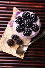Healthy breakfast - yogurt with  blackberries and muesli served
