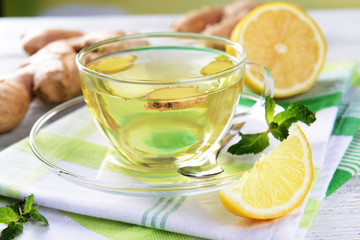 Ginger tea with lemon on table close-up