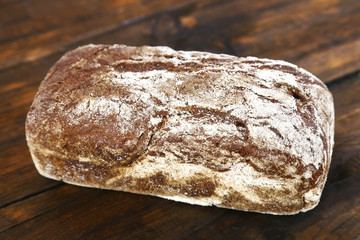 Rye bread on wooden background