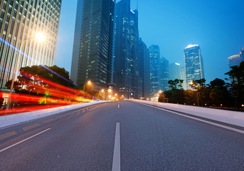 Asphalt road and modern city