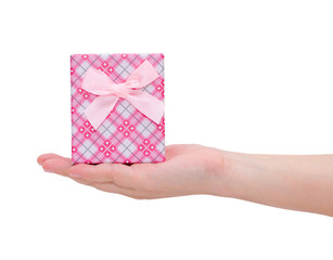 female hand holding  gift box with a bow isolated on white backg