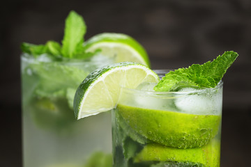two mojito cocktails on old oak table