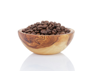 roasted coffee beans in olive wood bowl