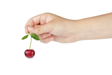 female teen hand hold cherry
