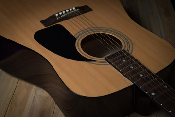 Obraz premium acoustic guitar on wooden background