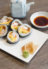 Sushi roll with ginger and wasabi