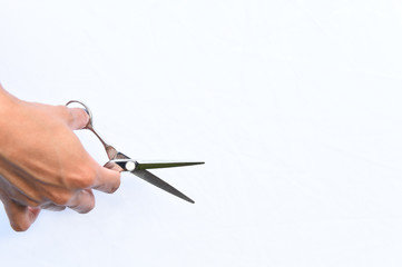 Hair's scissors in hands isolate on white background