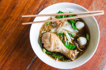 Chichken noodle on wooden table