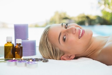 Obraz na płótnie Canvas Beautiful woman lying on massage table at spa center