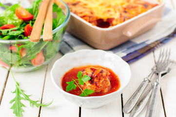 Pork Meatballs baked with Tomato Sauce and Cheese