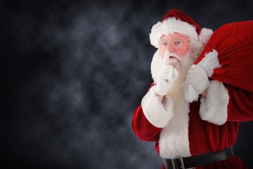 Composite image of santa claus carrying sack