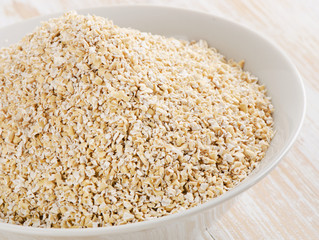 Healthy Oat bran on  wooden table