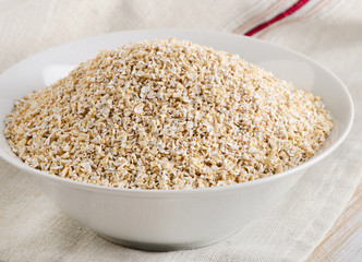 Healthy Oat bran in a  white bowl