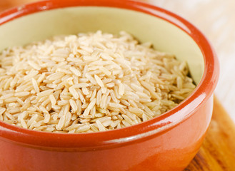 natural brown rice in  a bowl.