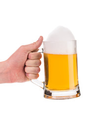 Frosty glass of beer with hand