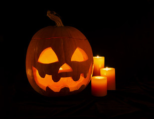 Pumpkin head with three candles