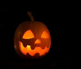 Alone pumpkin head in the darkness