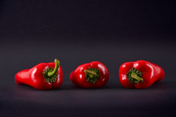 Red peppers on a black background. Ajvar
