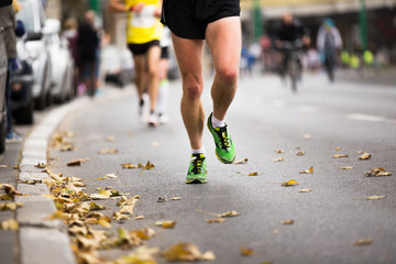 Marathon running city race, people feet on street