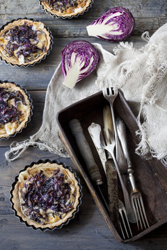 homemade purple cabbage rustic quiche and box with silverware