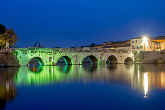 Rimini. Twilight on historical Tiberius bridge.