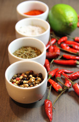 Mix of spices on the wooden background