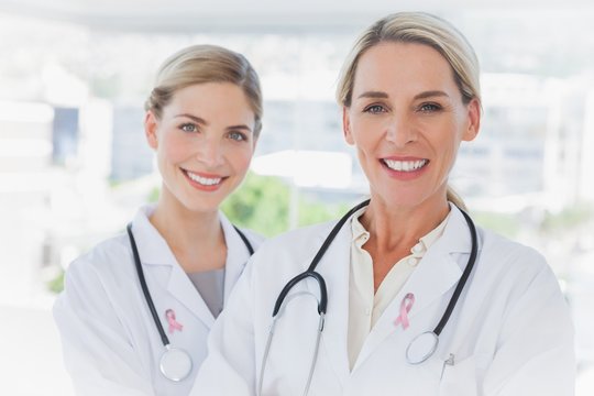 Composite image of blonde doctors standing together
