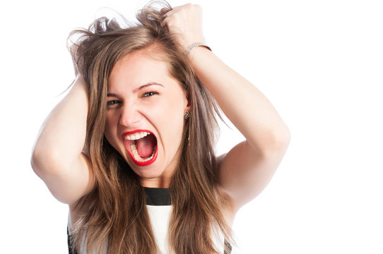 Woman screaming and grabbing her hair.