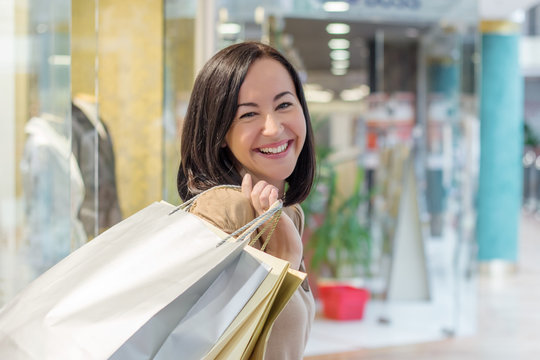 Young woman carry shopping bags while shopping