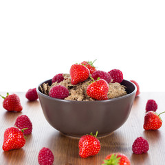 Bran flakes with fresh raspberries and strawberries