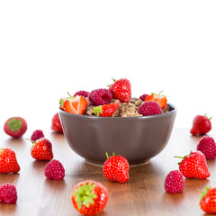 Bran flakes with fresh raspberries and strawberries