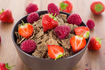 Bran flakes with fresh raspberries and strawberries