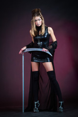 Elegant nun with a scythe