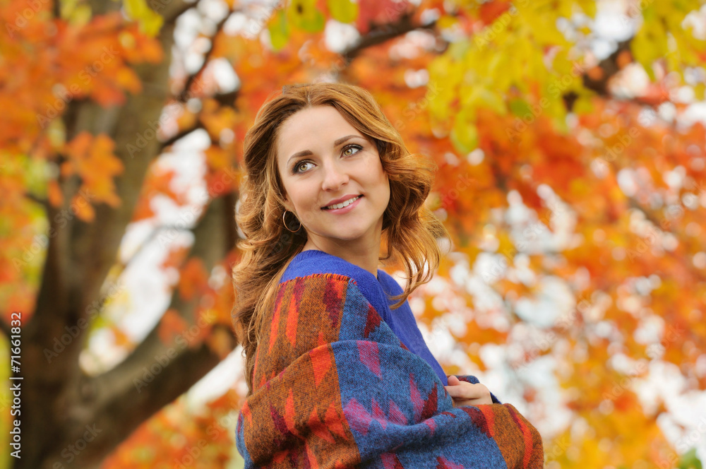 Wall mural autumn portrait of beautiful stylish young woman in blue knitted