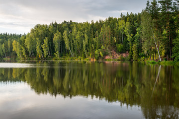 Fototapeta premium river with reflections in weater and sandstone cliffs