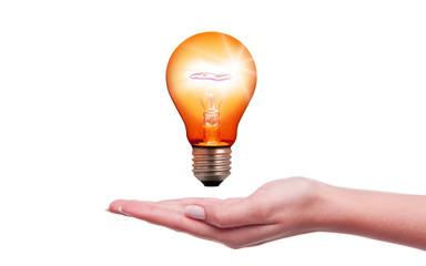 Light bulb over hand