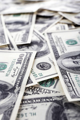 Lot of one hundred dollar bills close-up background